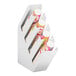 A white Cal-Mil slanted cup and lid organizer.