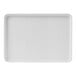 A white rectangular Cal-Mil melamine tray with a raised rim.
