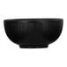 A black Cal-Mil melamine bowl with a black rim.