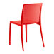 A red resin side chair by Lancaster Table & Seating.