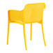 A yellow resin arm chair by Lancaster Table & Seating.