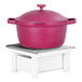 A pink pot with a lid on a white Cal-Mil chafer stand.