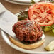 A plate with a Ratner's Veggie Grillers vegan burger and vegetables on it.