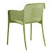 A Lancaster Table & Seating Rio Sea Moss Green resin arm chair with woven seat and legs.