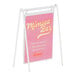 A white metal Cal-Mil card holder with a pink sign reading "menu" in white text.