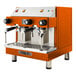 An orange Astra Mega II compact espresso machine with two spouts.