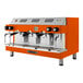 An orange and silver Astra Mega III automatic espresso machine.
