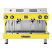A yellow and silver Astra Mega II espresso machine.