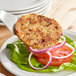 A Gardein veggie burger on a plate with vegetables.