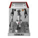 A silver and red Astra Gourmet espresso machine with red handle.