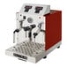 An automatic milk and beverage steamer with two wands, featuring a gloss red exterior and stainless steel front panel.