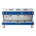 An Astra Mega III blue and silver automatic espresso machine with three buttons.