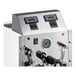 A commercial automatic milk and beverage steamer with two steam wands and digital controls.