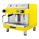 A yellow and silver Astra Mega I espresso machine with two spouts.