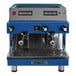 An Astra Mega II blue and silver automatic espresso machine with two metal handles.