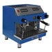 An Astra Mega II automatic blue espresso machine with two silver handles.