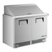A True stainless steel 2 door mega top refrigerator on a counter.