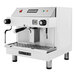 A white Astra Mega I espresso machine with buttons and a screen and a black handle.