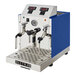 An automatic two-wand milk and beverage steamer with a gloss blue exterior and stainless steel front panel.