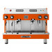 An orange and silver Astra Mega II automatic espresso machine.