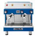 A blue and silver Astra Mega II compact espresso machine with two coffee cups.