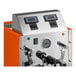 An automatic two-wand milk and beverage steamer with a gloss orange exterior and digital controls.