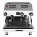 A white and silver Astra Mega II compact automatic espresso machine with knobs and buttons. Two coffee cups sit on top.