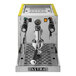 A silver and yellow Astra Gourmet espresso machine with a yellow handle.