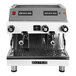A white and silver Astra Mega II compact espresso machine with knobs and buttons. Two coffee cups sit on top.