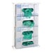 A wall mount rack of Omnimed disposable glove boxes with green gloves inside.