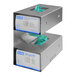 A silver stainless steel wall-mount glove dispenser with two open boxes of blue gloves.