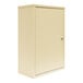 A beige metal Omnimed wall-mount narcotics cabinet with a door.