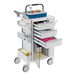 An Omnimed white medical cart with drawers and a tray on top.