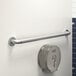 A Lavex silver metal grab bar with a peened grip.