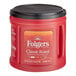 A red Folgers Classic Roast ground coffee can with a black lid.
