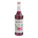 A bottle of Monin Ube Flavoring Syrup with a label on a white background.