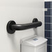 A Lavex matte black grab bar on a white wall.