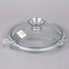 A clear glass lid with a handle for a Robot Coupe commercial food processor.