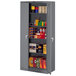 A dark gray metal Tennsco storage cabinet with shelves and solid doors.