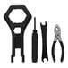 A black Flushmate installation tool kit with pliers, a wrench, and a screwdriver.