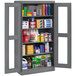 A dark gray Tennsco storage cabinet with C-Thru doors filled with items.