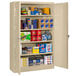 A Tennsco sand-colored jumbo storage cabinet with solid doors and a keyed lock.