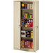 A sand-colored Tennsco metal storage cabinet with shelves full of items.