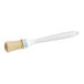 A white round boar bristle pastry brush with a white plastic handle.