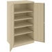 A tan metal Tennsco storage cabinet with open doors.