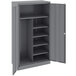 A dark gray metal Tennsco storage cabinet with solid doors.