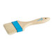 An Ateco baking and pastry brush with a wooden handle and blue bristles.