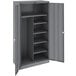 A dark gray metal Tennsco combination cabinet with shelves.