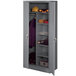 A dark gray Tennsco steel combination cabinet with solid doors.