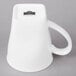 A 10 Strawberry Street white porcelain mug with a handle.